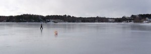 Walking on the ice past a mooring buoy, Jan. 25